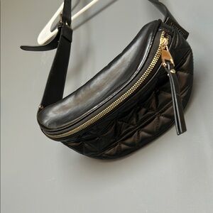 Black Crossbody Bag with Quilted Texture and Gold Accents